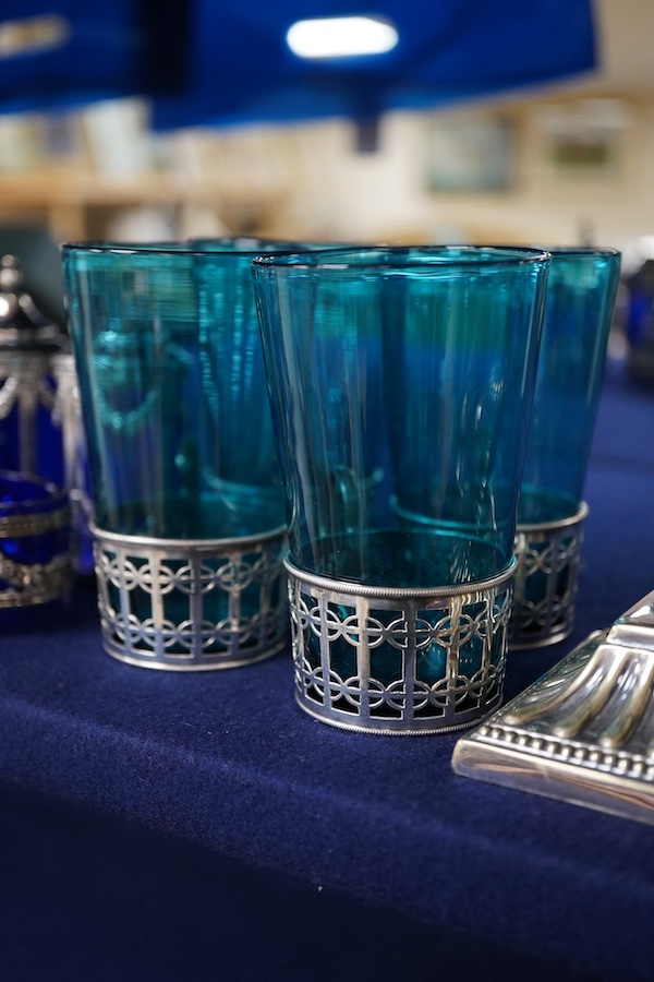 Four coloured glasses with silver stands a similar glass swan salt, a three piece cruet with white metal mounts and a plated single stem epergne, glasses and stands 9cm high., Condition - good